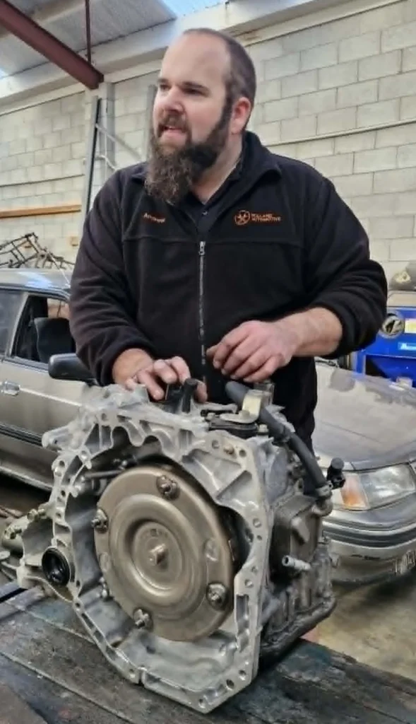 Mechanic carrying out transmission inspection at Holland Automotive in Whanganui